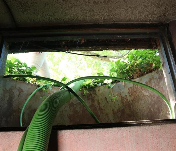 Broken window in old home causes basement water damage in Storrs, CT